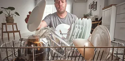 man-overloading-dishwasher